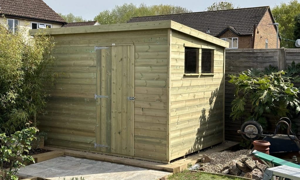 6x12 garden shed with single door and 2 windows pent roof.