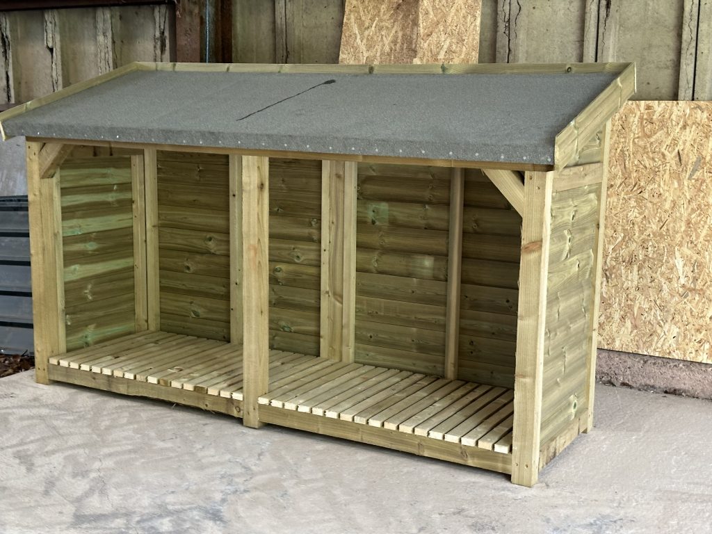 8ft log shed with a forward sloping roof with felt