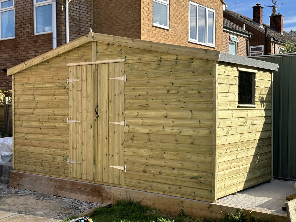 14x6 garden shed with a apex roof sloping long ways, double doors and a single window