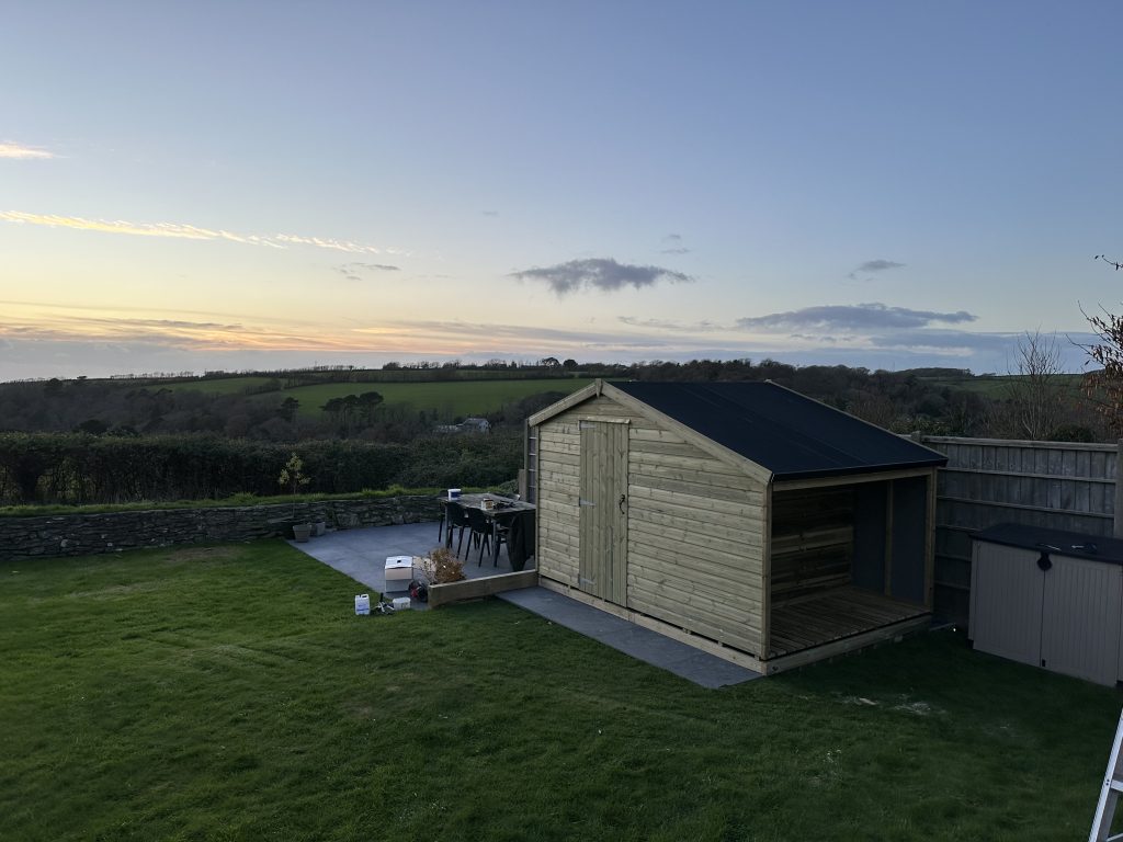 8x8 garden shed with a added 3ft log shed on one end. this shed has a epdm apex roof, single door and no windows