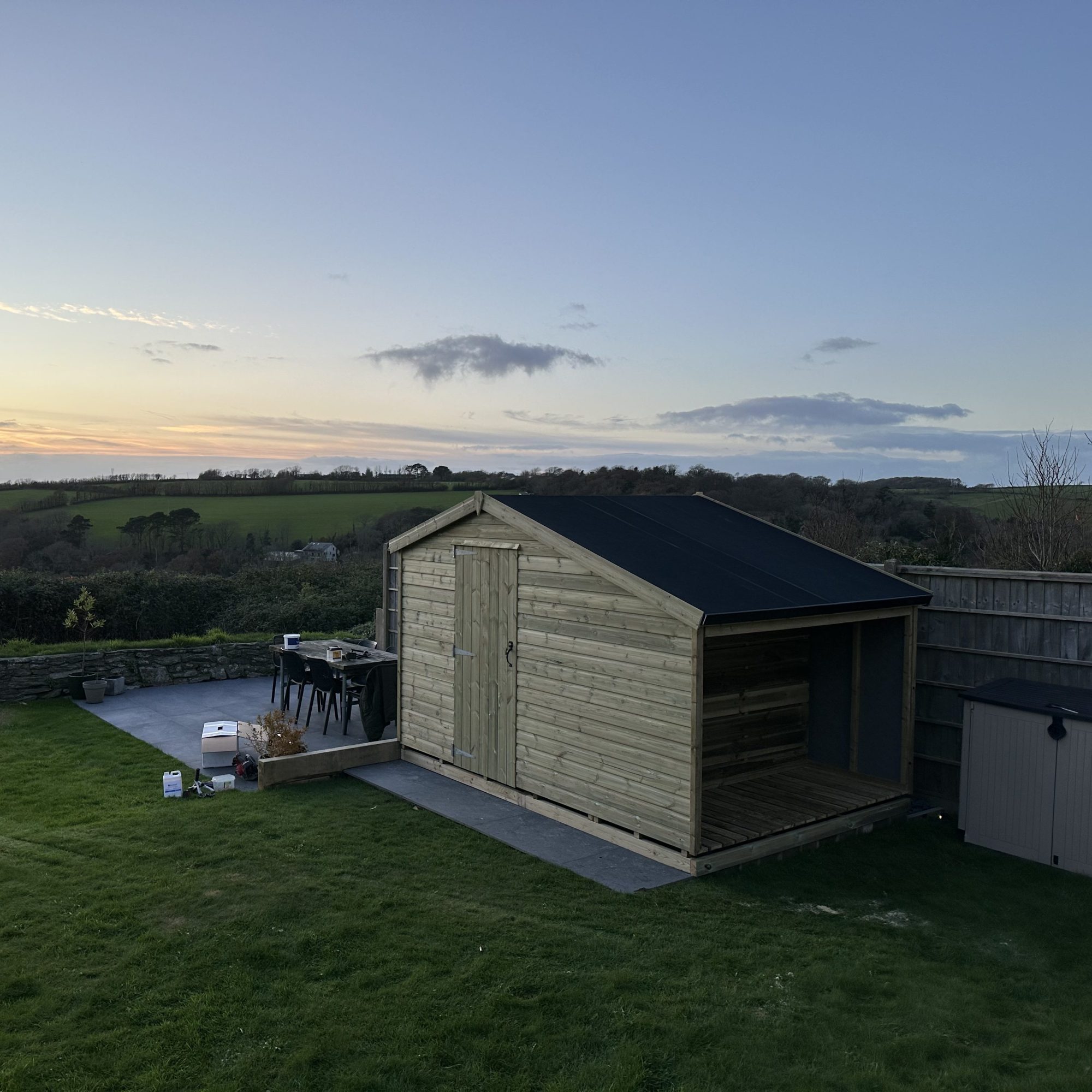 8x8 garden shed with a added 3ft log shed on one end. this shed has a epdm apex roof, single door and no windows